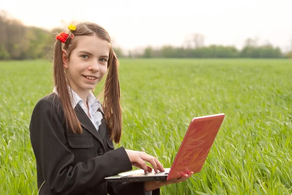 Teen girl with a notebook sitting outdoors — Stock Photo, Image