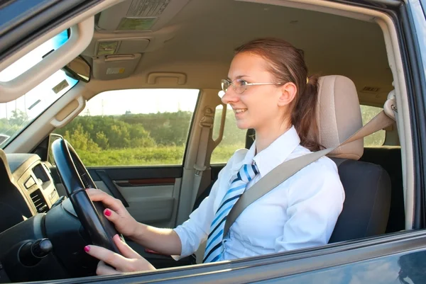 stock image Young lady driving a car