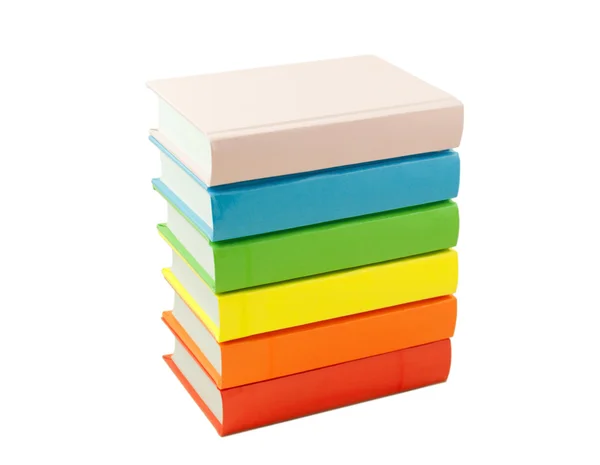 Pilha dos livros coloridos isolados em branco — Fotografia de Stock