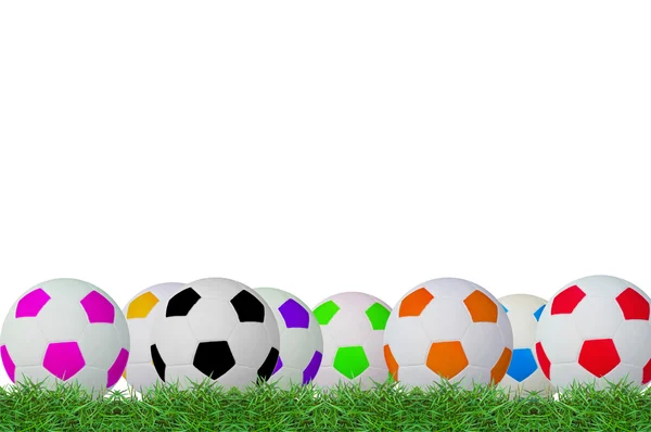 Piłki na zielonej trawie — Zdjęcie stockowe