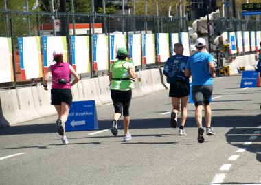 Group of athletes of all ages are running a marathon clipart