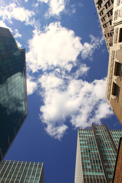 The towers on background of blue sky with clouds