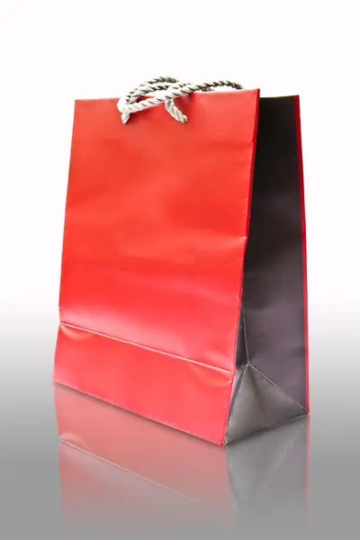 Reflection red paper bag isolated — Stock Photo, Image