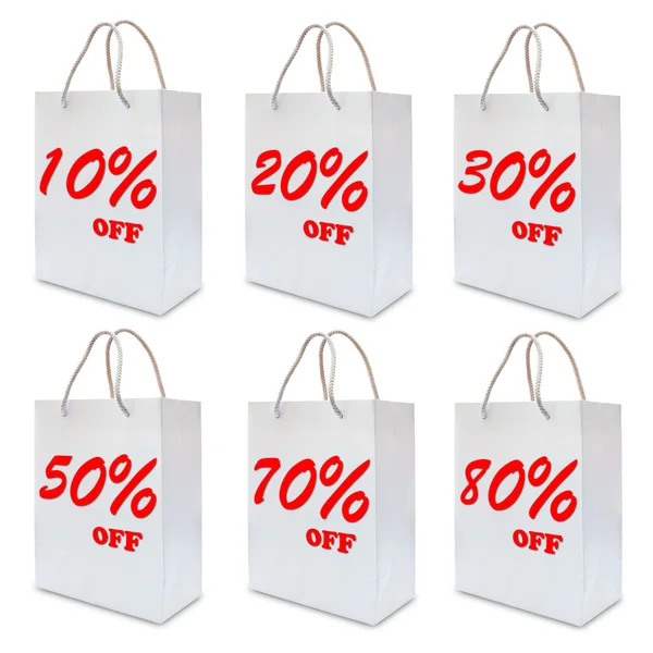 Discount sign label on white paper bag — Stock Photo, Image
