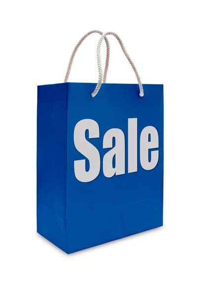 Sale label on blue shopping paper bag — Stock Photo, Image