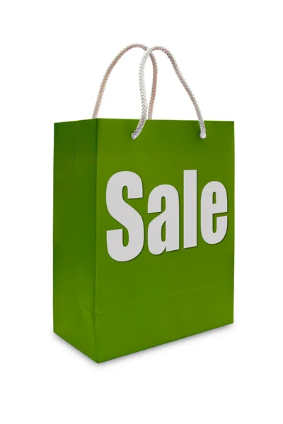 Sale label on green shopping paper bag — Stock Photo, Image