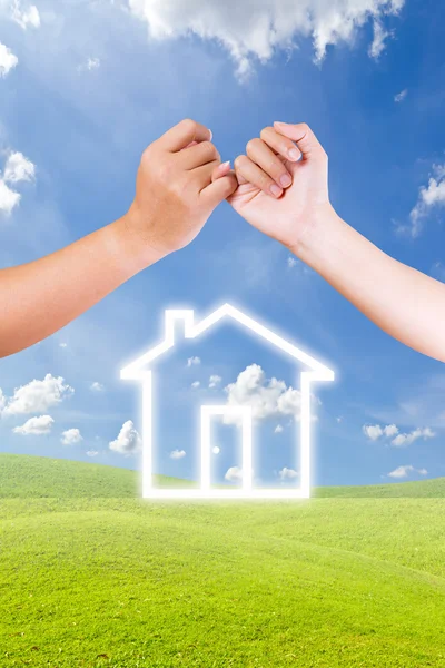 Hand linking finger and house icon — Stock Photo, Image