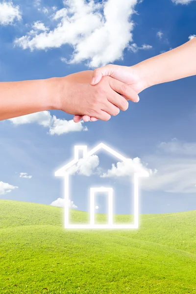 Hand shaking and house icon — Stock Photo, Image