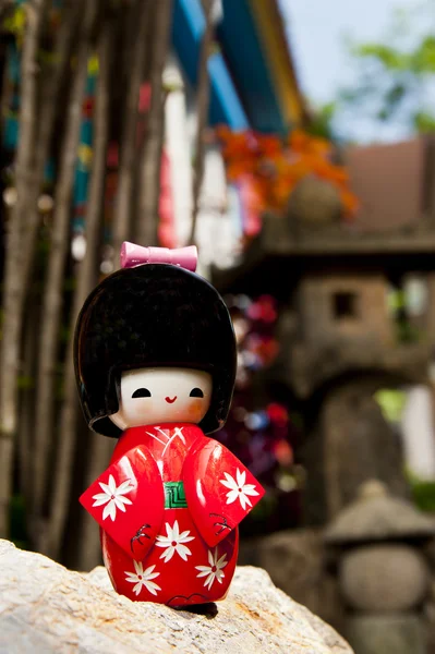 Stock image Zoom in lonely Japanese doll on the rock