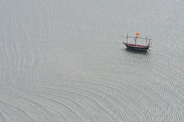 stock image Lonly fishing boat in the sea