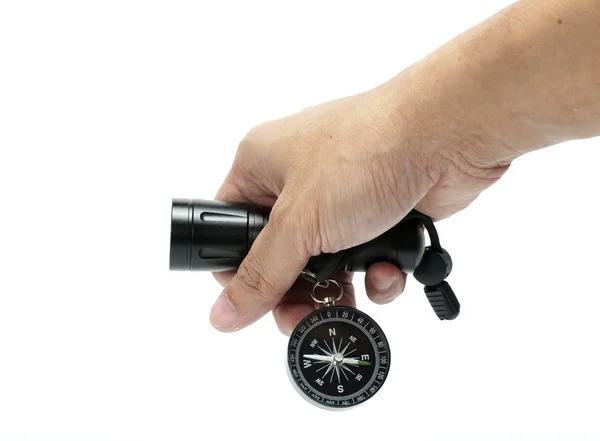 Flashlight and compass in hand — Stock Photo, Image