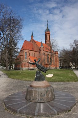 Lithuania, Druskininkai. Catholic Church and sculpture. clipart