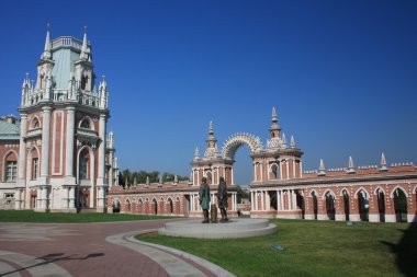 Moscow. Museum “Tsaritsyno”. Galarea-the fence with a gate and tower. clipart