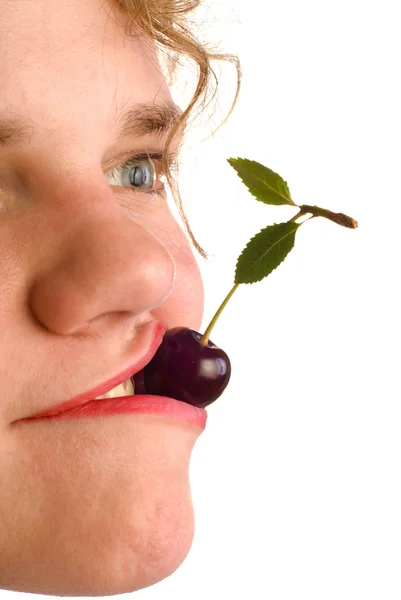 Holding cherry in mouth — Stock Photo, Image