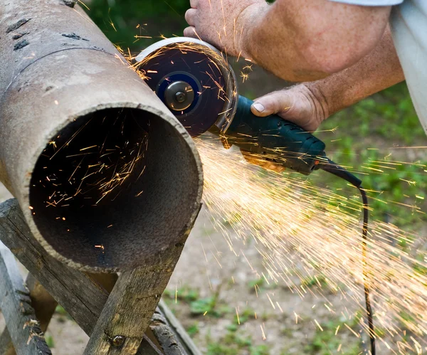 stock image Sawing metal pipe