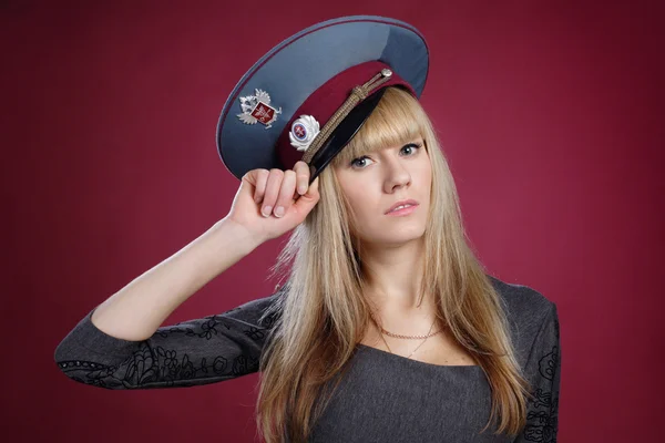 Attractive sexy blond woman in service cap — Stock Photo, Image