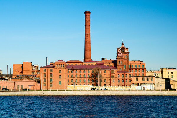 The old factory building on the banks of the Neva River