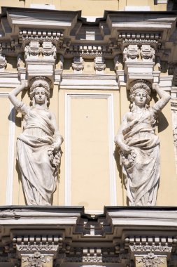 Caryatid on the facade of the old building. Fontanka Embankment. clipart