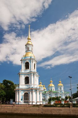 Nicholas Naval Cathedral in the background of blue sky with clou clipart