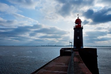 Lighthouse over blue sky in Bremerhaven clipart