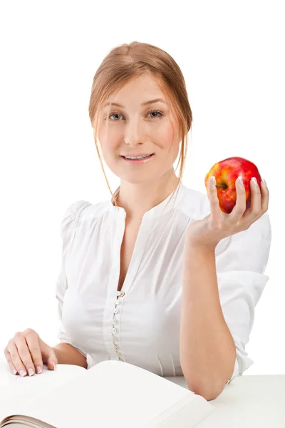 Woman with apple and book — Stock Photo, Image
