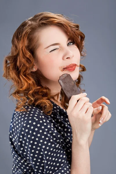 Happy smiling woman eating chocolate — Stock Photo, Image
