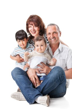 Happy grandparents with two handsome grandsons clipart