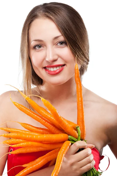 Attractive woman holds bunch of carrots — Stock Photo, Image