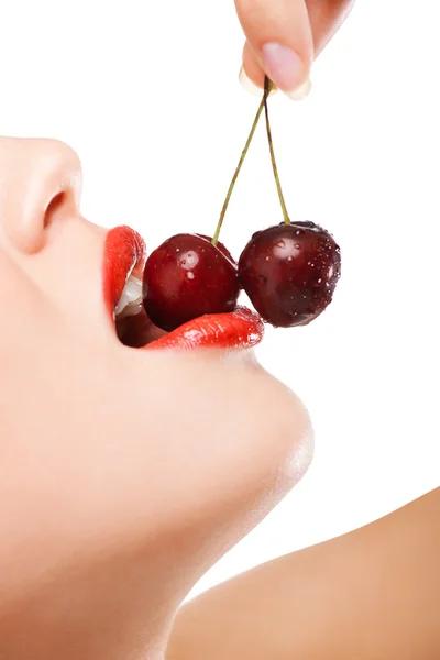 stock image Young woman's mouth with red cherries