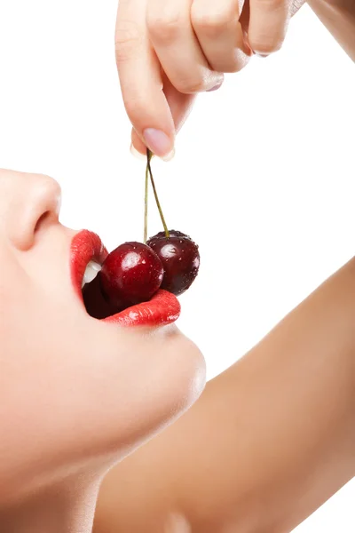 Stock image Young woman's mouth with red cherries