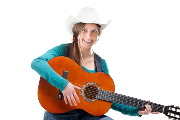Cowgirl in ahat with acoustic guitar — Stock Photo, Image
