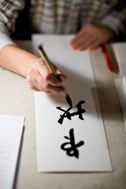 Writing Chinese Calligraphy clipart