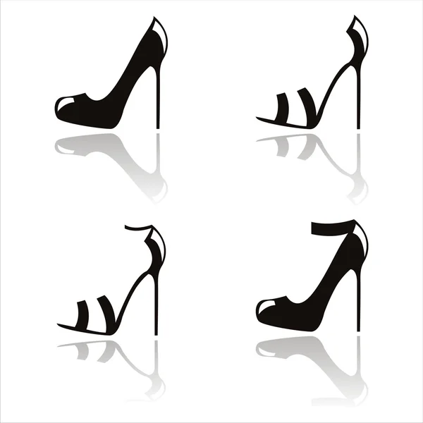 Black shoes silhouettes — Stock Vector