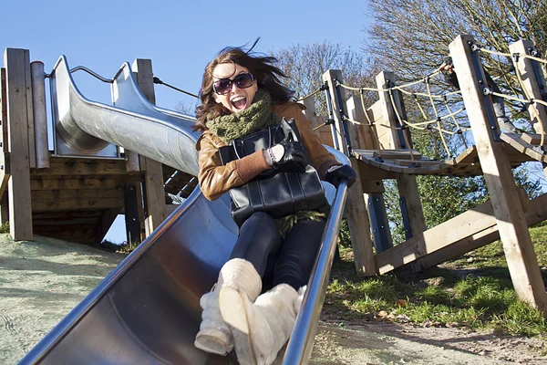 Girl on the slide — Stock Photo, Image
