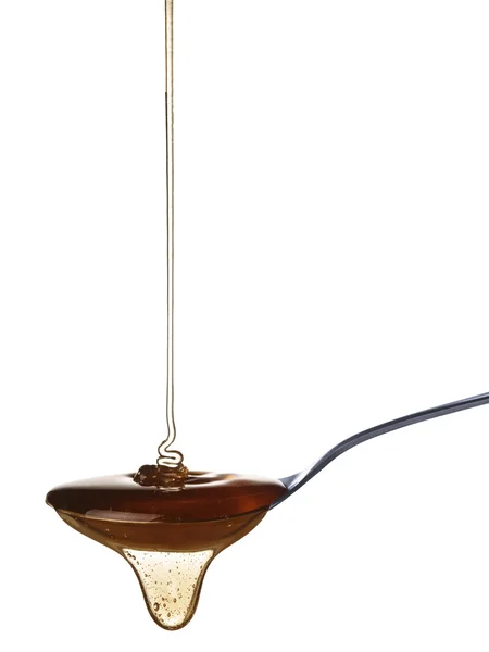 Honey and spoon — Stock Photo, Image