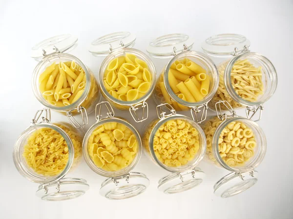 Glass jar filled with pasta — Stock Photo, Image