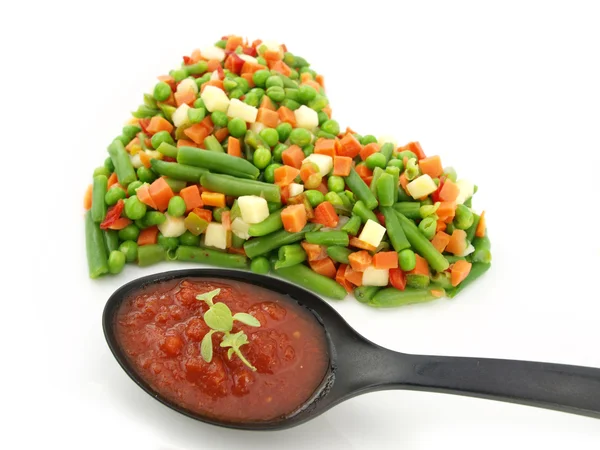 Heart of a frozen mixed vegetables — Stock Photo, Image