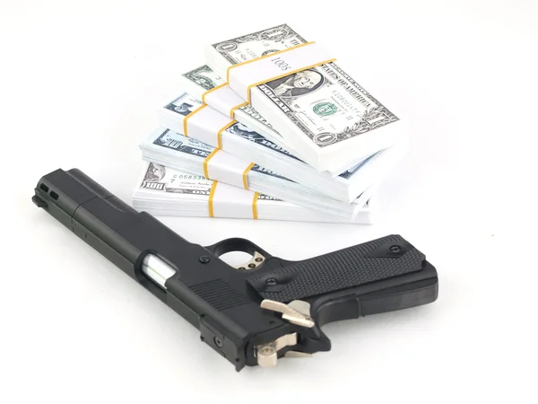 stock image Gun and money