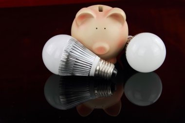 LED light bulbs with piggy bank clipart