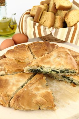 Homemade puff spinach pie with filo pastry clipart