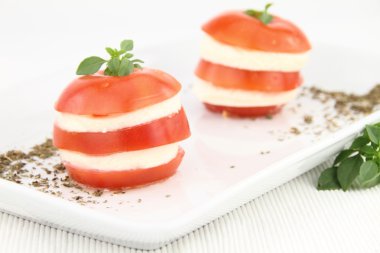 Caprese salad with tomatoes, mozzarella and basil clipart