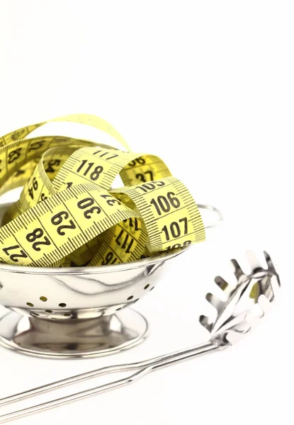 Tape measure inside a strainer — Stock Photo, Image