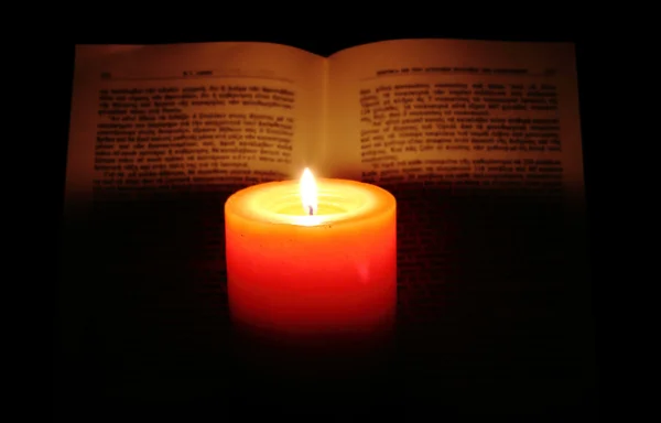 stock image Candle and book on dark background