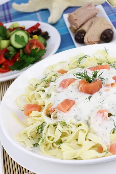 Tagliatelle pasta with cream, salmon and anise — Stock Photo, Image