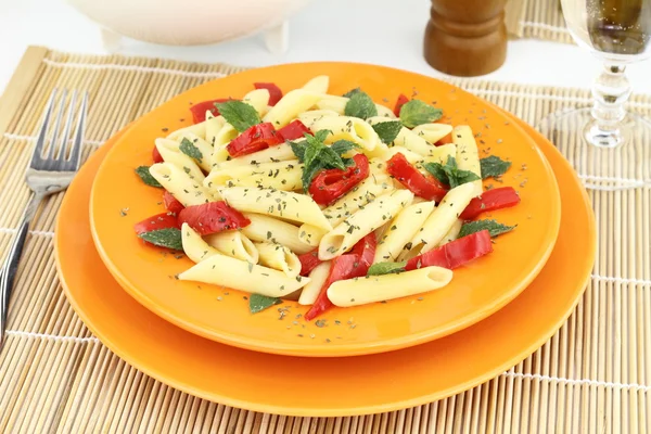 Penne pasta with red peppers and mint — Stock Photo, Image