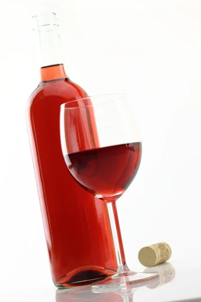 Glass and bottle of rose wine — Stock Photo, Image