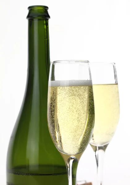 Láhve a sklenice šampaňského — Stock fotografie