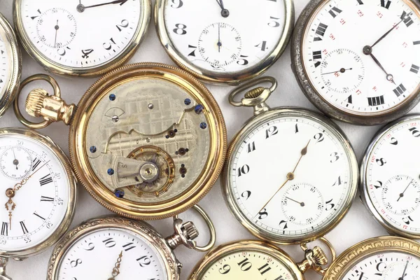 Various Antique pocket clocks on white — Stockfoto