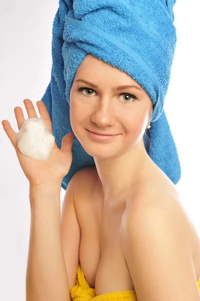 Beautiful young woman in towel — Stock Photo, Image