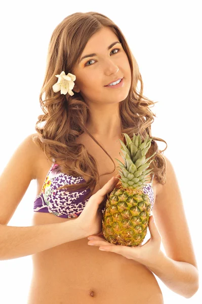 Portret van een jong meisje met ananas — Stockfoto